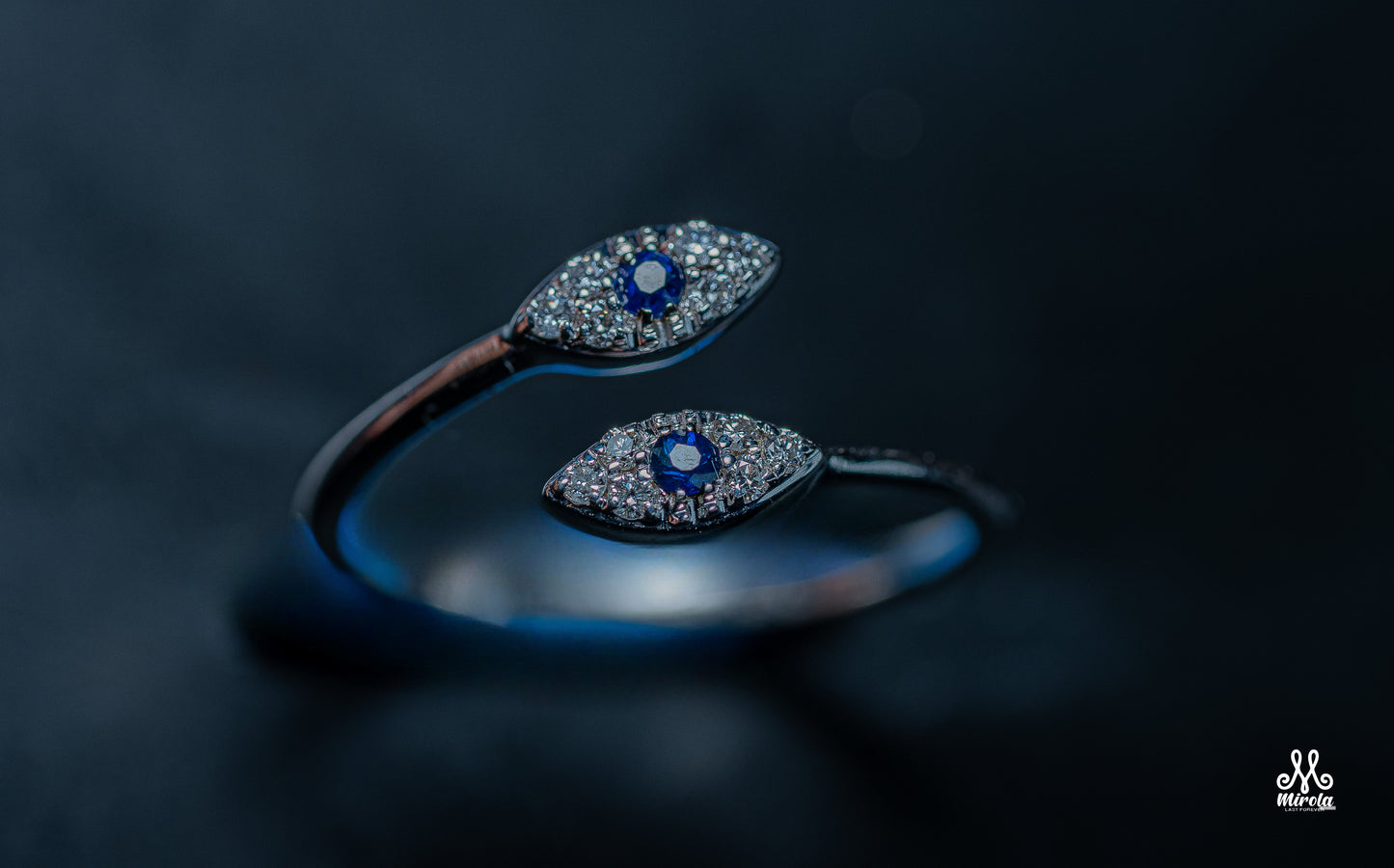 14K white gold ring with blue sapphire stones