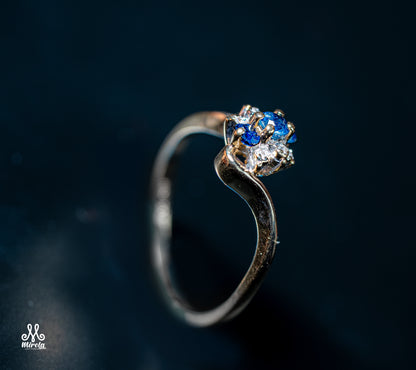 14K floral cluster design with blue sapphires and diamonds ring