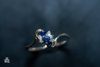 14K floral cluster design with blue sapphires and diamonds ring