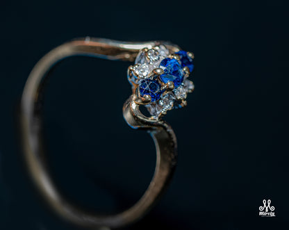 14K floral cluster design with blue sapphires and diamonds ring